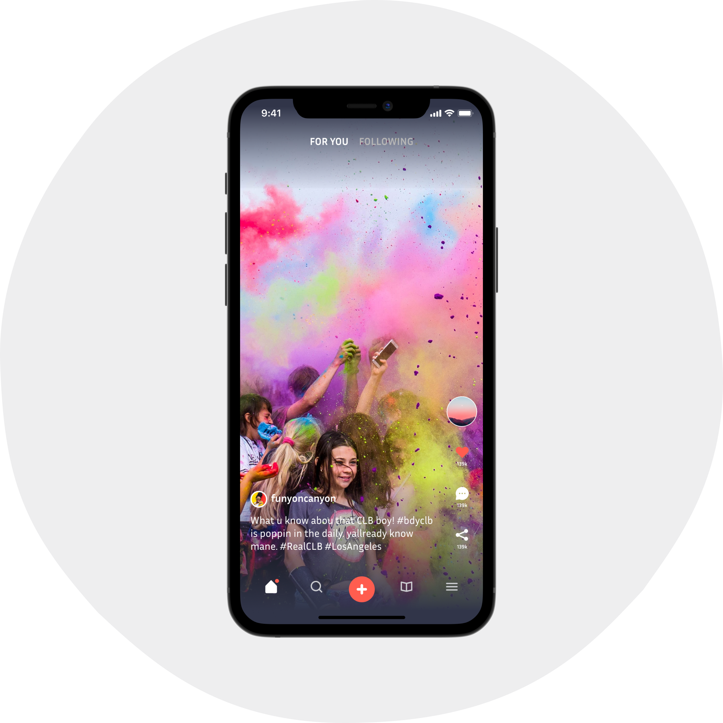 Picture of someones hand holding a smartphone. In said hand they have an app open on a video. Some huge colorful party...the video's focused on someone who is not on their phone. Nice one.